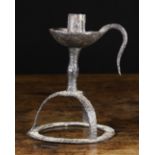 An 18th Century Wrought Iron Candlestick.