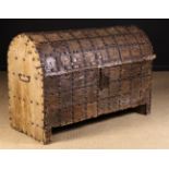 A 16th/17th Century Dome Topped Chest, clad in hide with iron bands and stud-work,