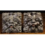 A Pair of Fine 17th Century Carved Wooden Leafy Green Man Face Masks depicted with scaring eyes and