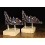 A Pair of 17th Century Carved Oak Spandrels in the form of mythical beasts with scaly tails &