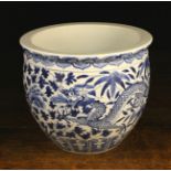 A 19th Century Blue & White Chinese Jardiniere decorated with dragons, flowers and foliage,