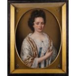 An Early 18th Century Oil on Canvas: Half length Portrait of a Lady dressed in a satin gown and