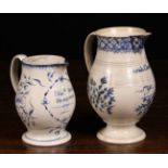 Two 18th Century Blue & White Baluster Jugs: One with a trellis border above inscription;