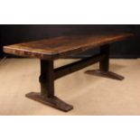 A 15th Century & Later Oak & Elm Trestle Table. The 3 inch (7.