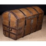 A Large 17th Century Dome Topped Oak Coffer bound in decoratively pierced iron straps,