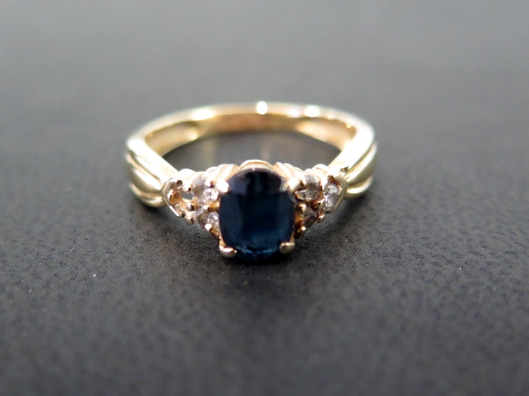 A sapphire and diamond dress ring - Tests as higher carat gold - Ring size N - Weight approx 3.