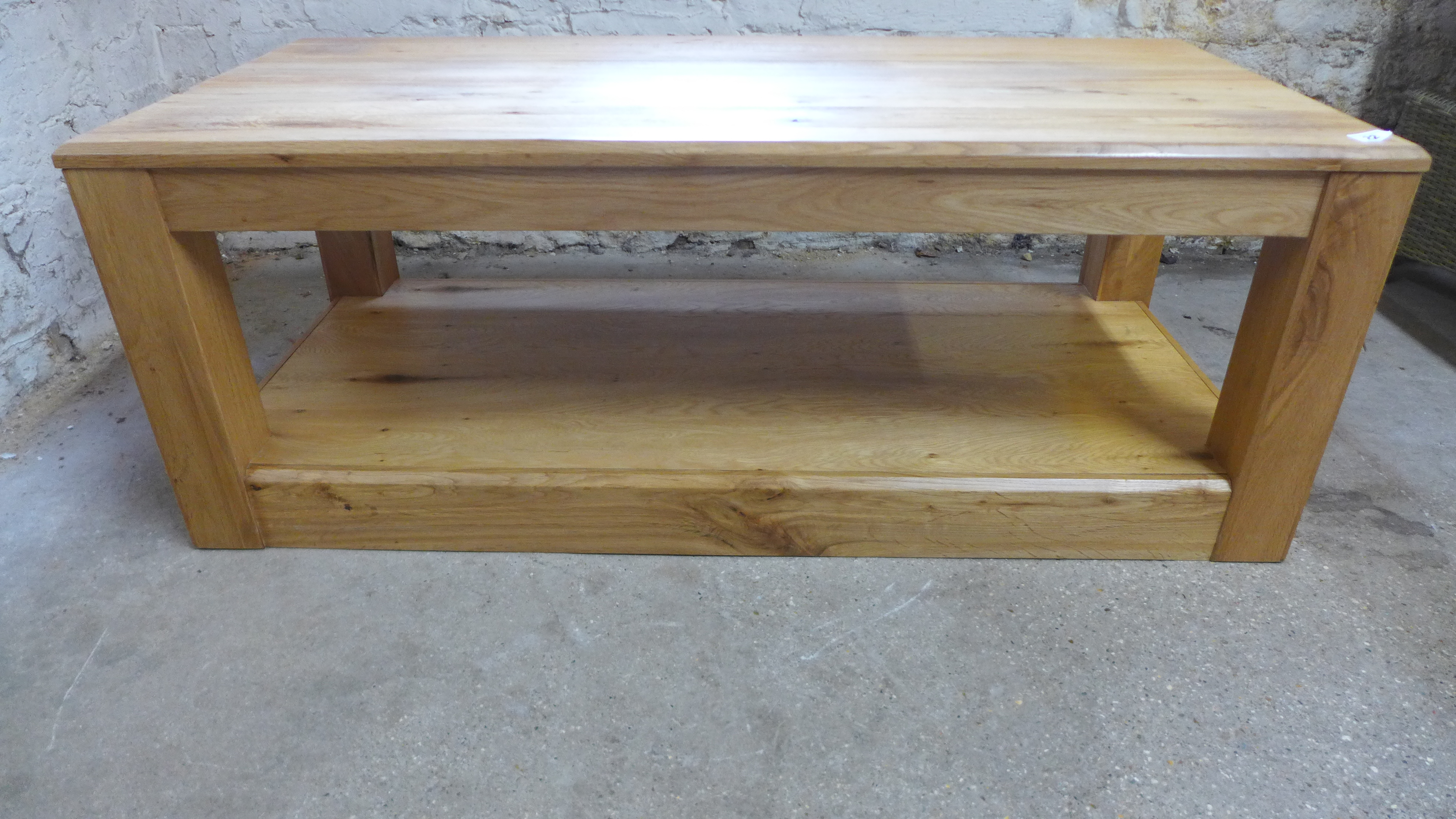 A modern oak coffee table with an under tier - Height 45cm x 120cm x 55cm