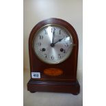 An Edwardian mahogany mantle clock - Height 26cm with pendulum and key