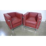 A pair of Le Corburier C52 type red leather and chrome armchairs - Height 68cm x 76cm x 70cm deep -