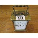 A brass carriage clock - Height 12cm - working