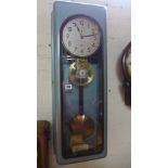A Continental TN metal cased master wall clock - 88cm x 31cm