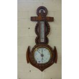 A carved oak aneroid barometer with thermometer in the form of an anchor and rope - Height 55cm -