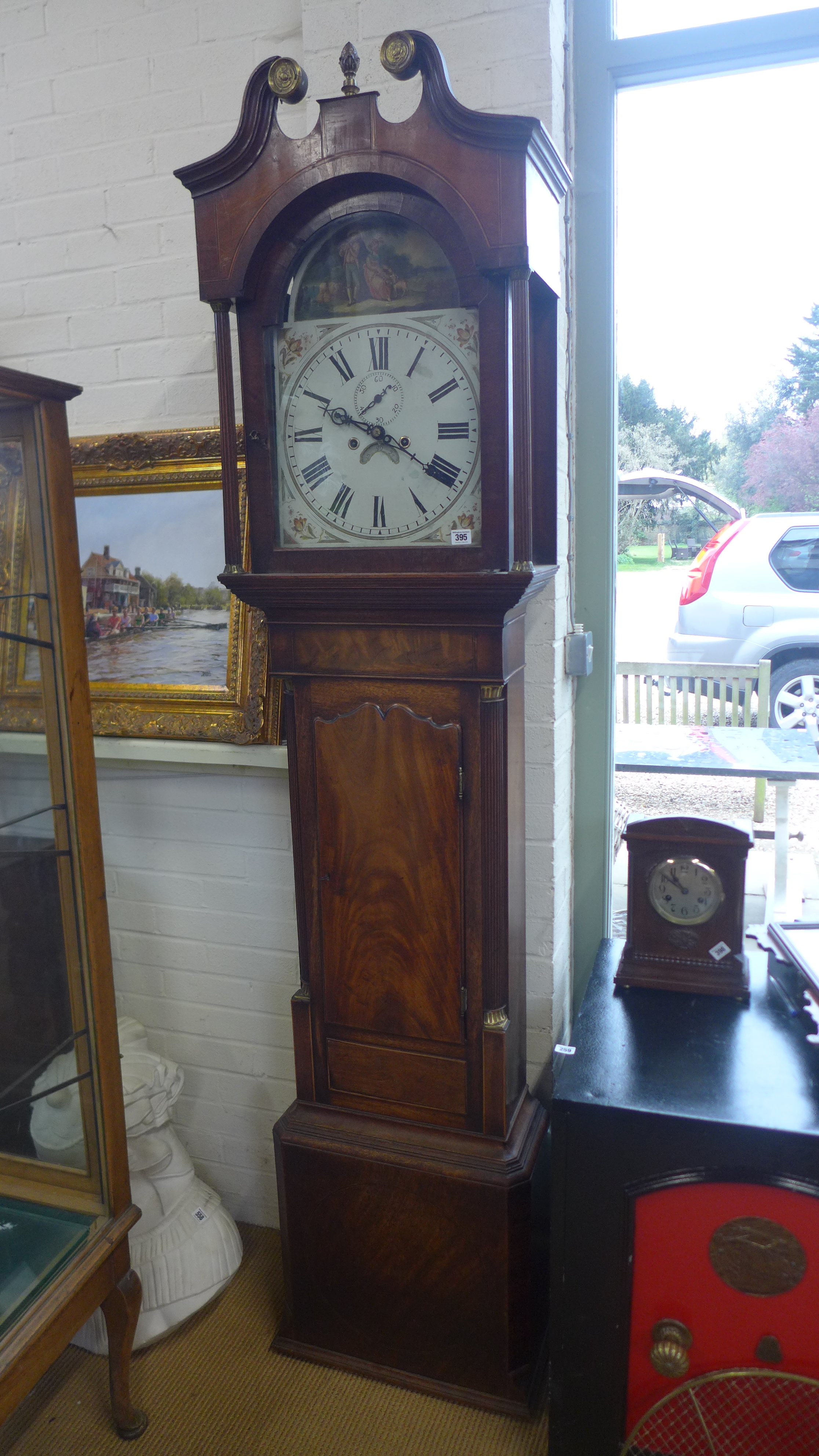 A 19th century eight day long case clock oak and mahogany case,