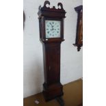 An 8 day grandfather clock with a painted 12 inch square dial with a seconds hand an calendar