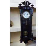 A 19th century ebonised Vienna single weight wall clock 120cm high with weight pendulum and key -