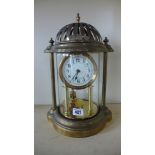 An unusual brass Anniversary clock with a pierced top - Height 36cm