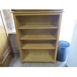 A set of oak open faced bookcase of four tiers raised on bracket supports - Height 134cm x Width