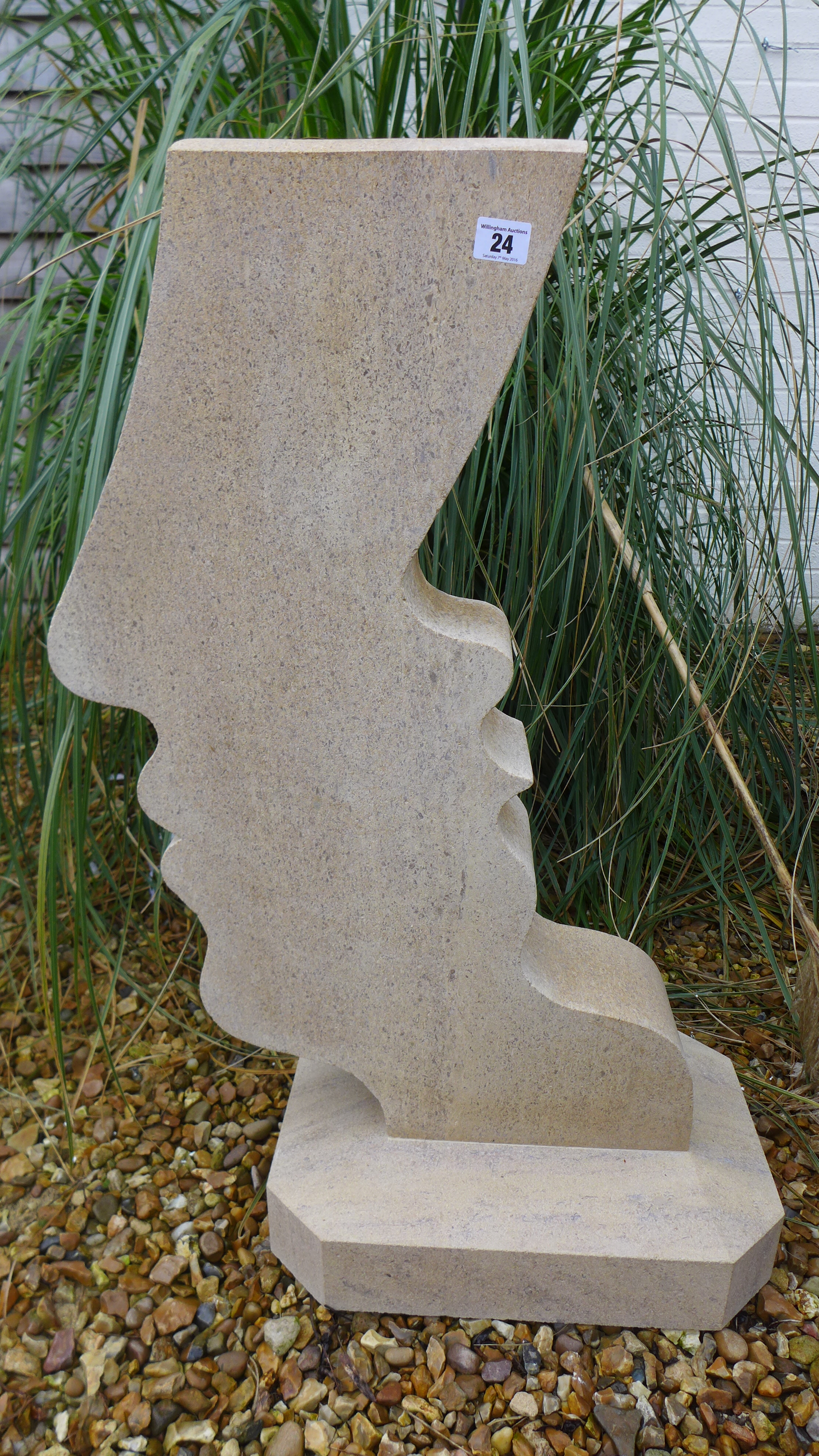 A hand carved stone garden sculpture - Height 84cm
