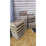 A collection of nine wooden fruit boxes and six trays