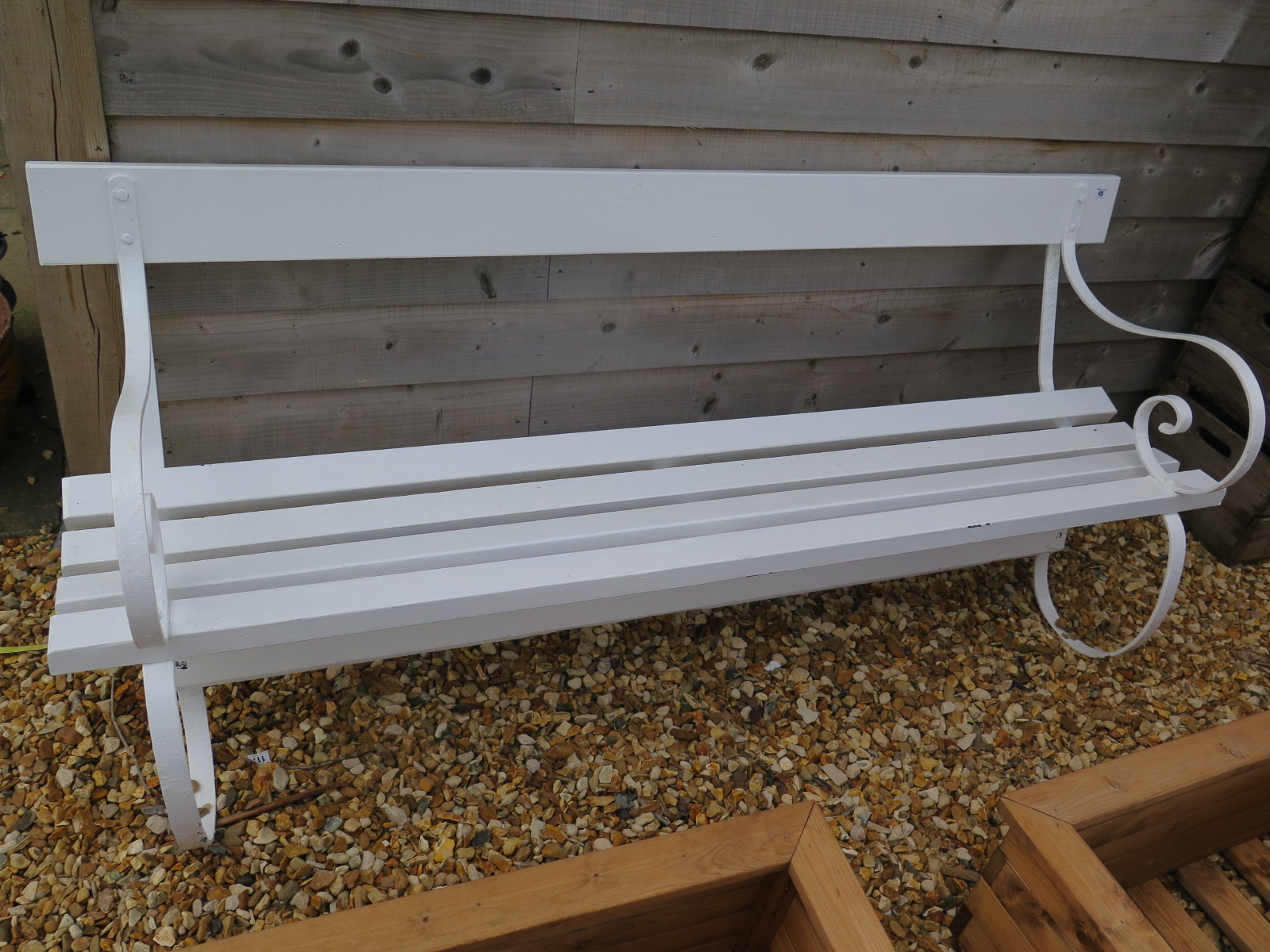 A white painted garden bench with painted iron ends - 185cm x 50cm x 77cm high