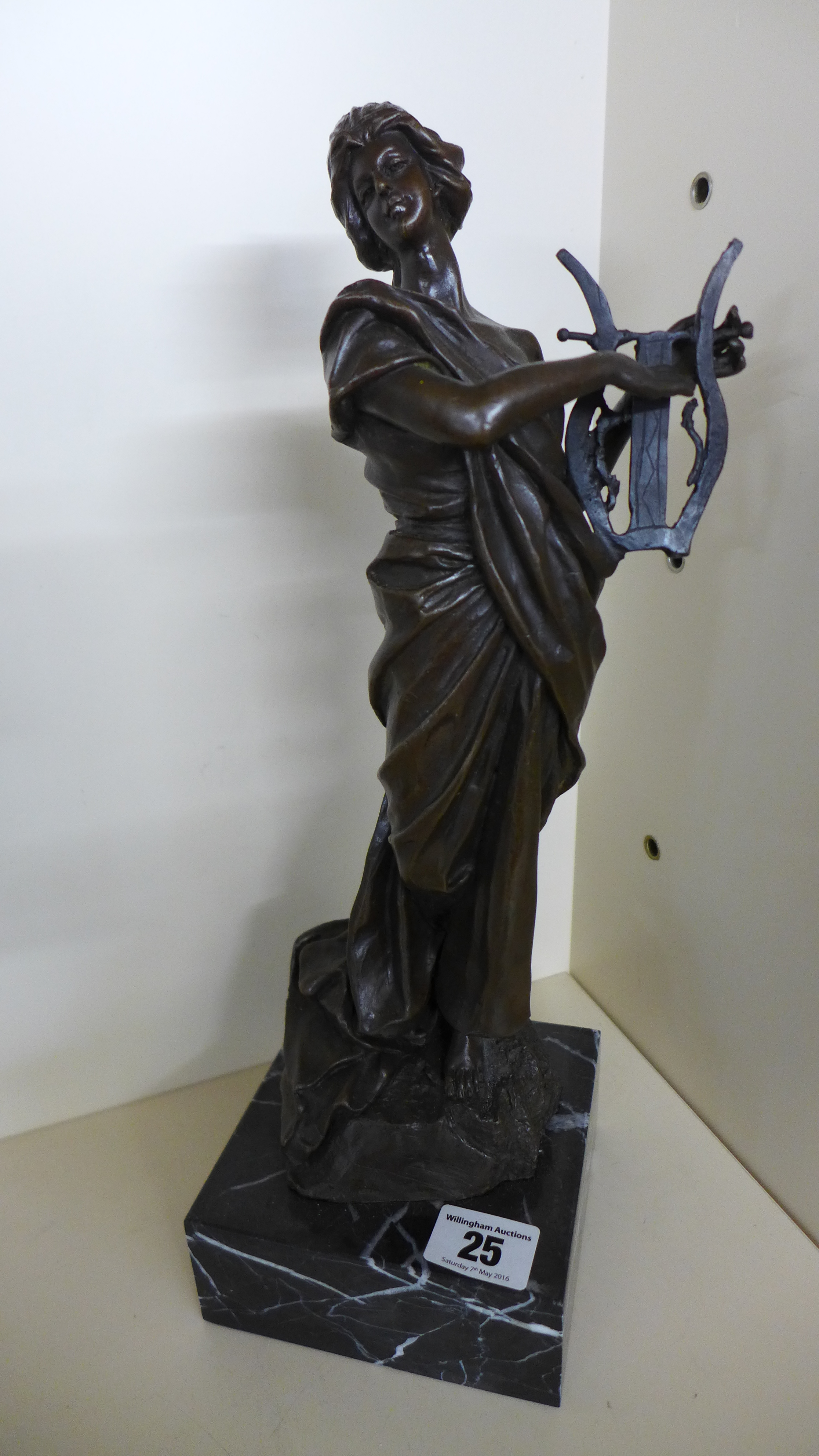 A bronze reproduction sculpture of a classical female figure playing lyre on marble base - Height