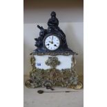 A 19th century ormolu marble and spelter figural mantle clock with silk suspension striking on a