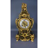 A French Boulle brass inlaid mantel clock with ormolu mounts with an 8cm diameter and gilt dial,