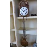 A gilt metal comtoise double weight wall clock with a 21cm enamel dial - Height 40cm