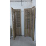 A pair of two panel screens with adjustable louver slats to tops - Height of each 211cm x Width