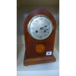 An eight day mahogany case with inlay French mantel clock,