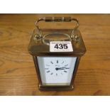 A brass cased carriage clock by Henley ,
