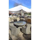 A Bramblecrest Patagonia 140cm round table with lazy susan, armchairs with cushions,