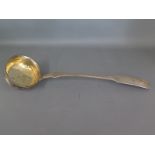 A large silver ladle of fiddle back design - Length 42cm - Weight approx.