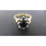 An 18ct yellow gold sapphire and diamond ring,