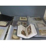 A collection of Edwardian and later postcards in seven albums