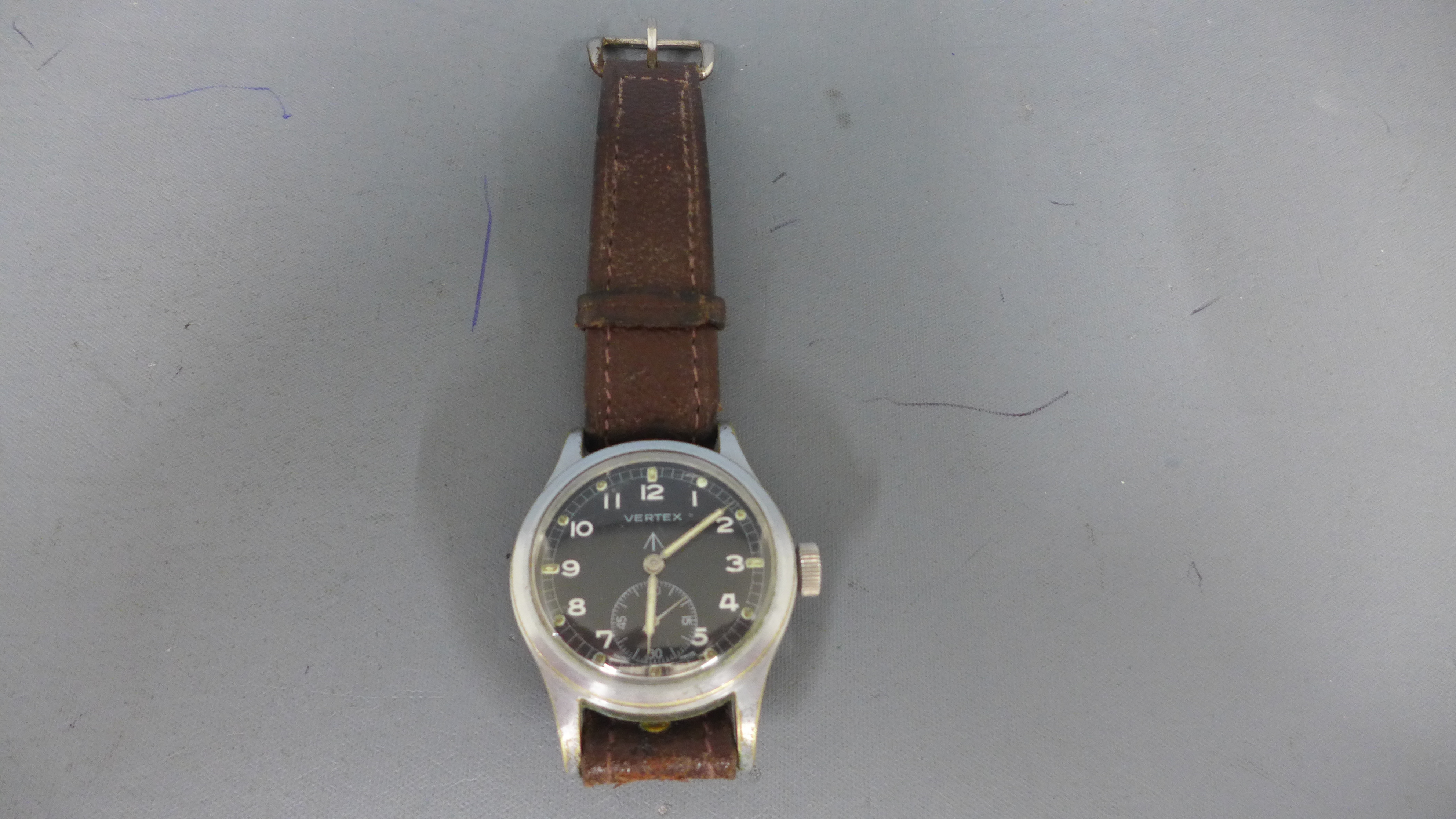 A gentleman's 1940's British Military issue WWII black dial vertex wristwatch manual wind movement,