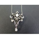 A late 19th/ early 20th century silver and gold diamond and freshwater pearl pendant - Of openwork