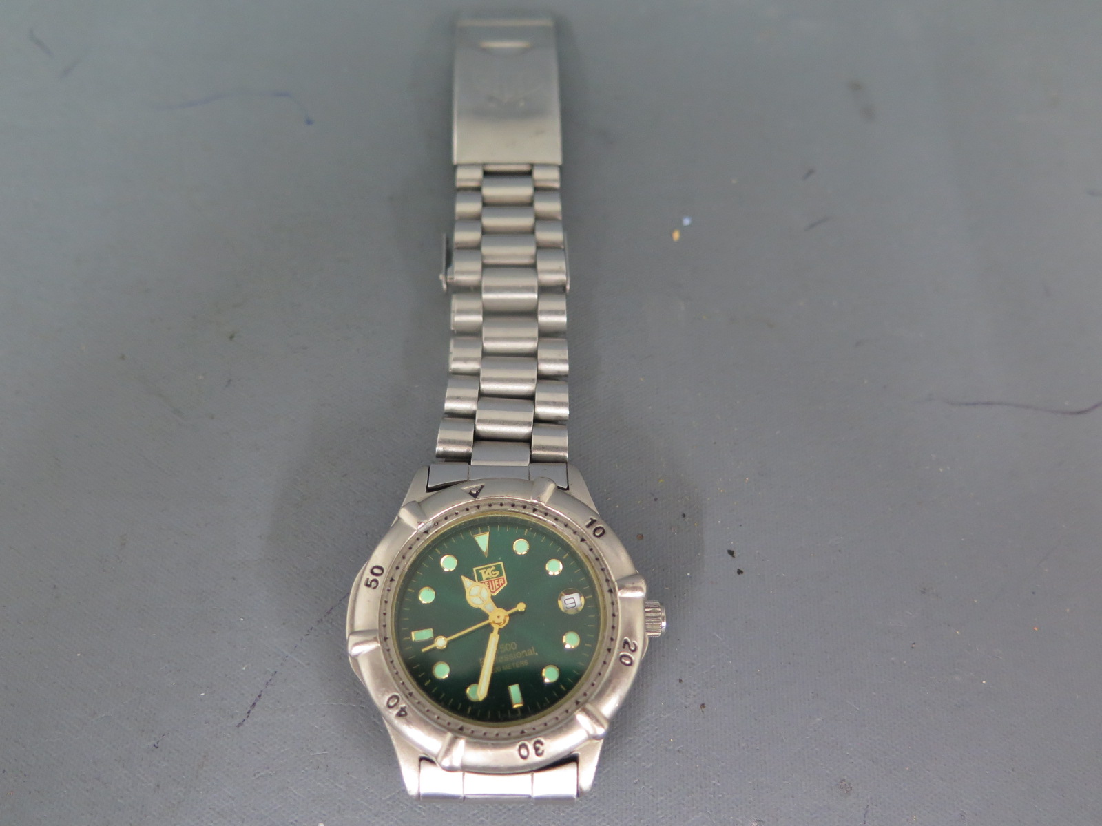 A Tag Heuer mid sized quartz wristwatch with offset dial date aperture - not in working order,