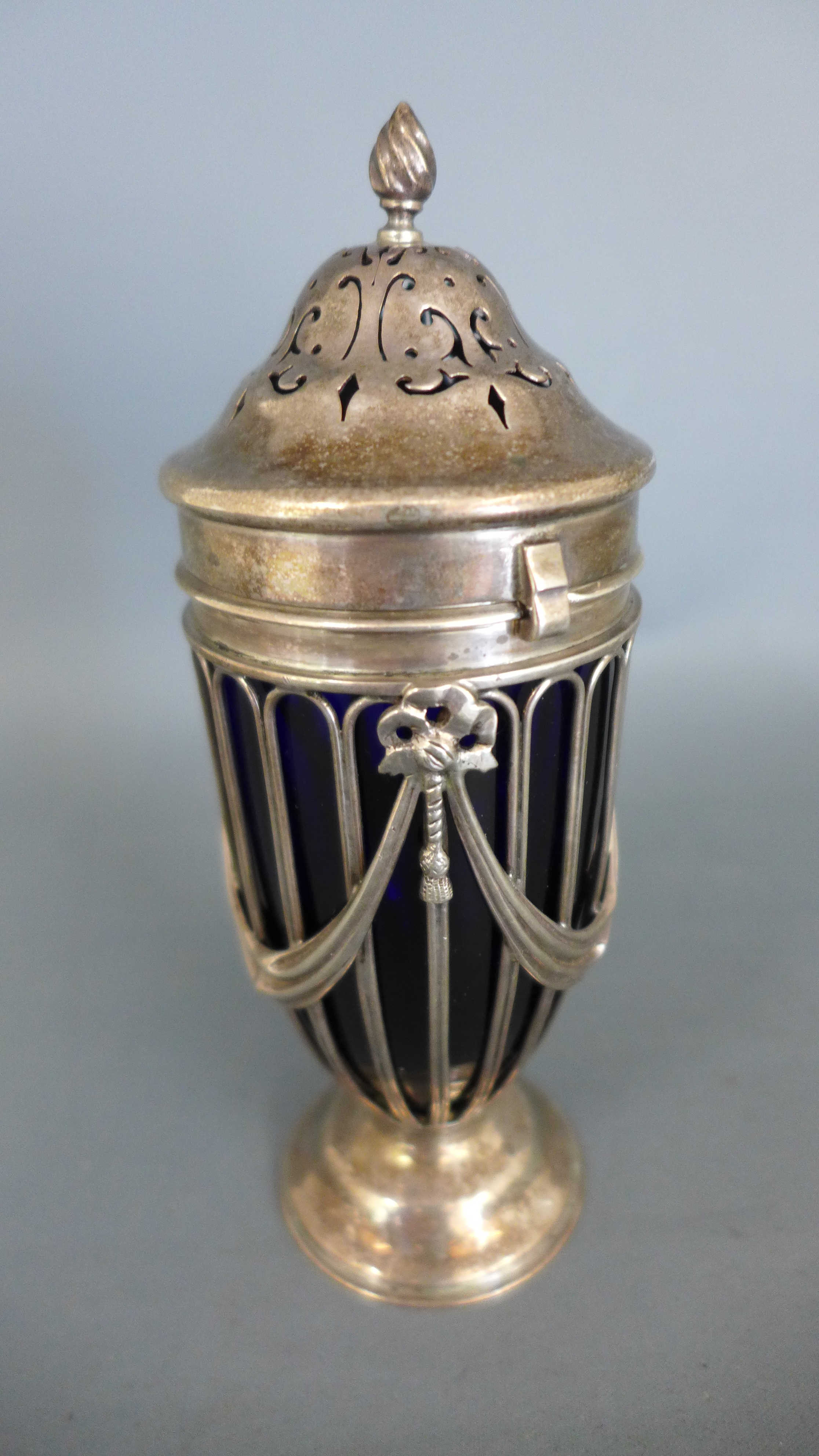 A silver caster with a blue glass liner - Chester 1901/02 E J H N H - Height 15cm Condition