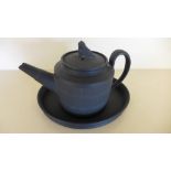 A 19th century black basalt small teapot on similar stand - Height 11cm - chips to spout and finial,