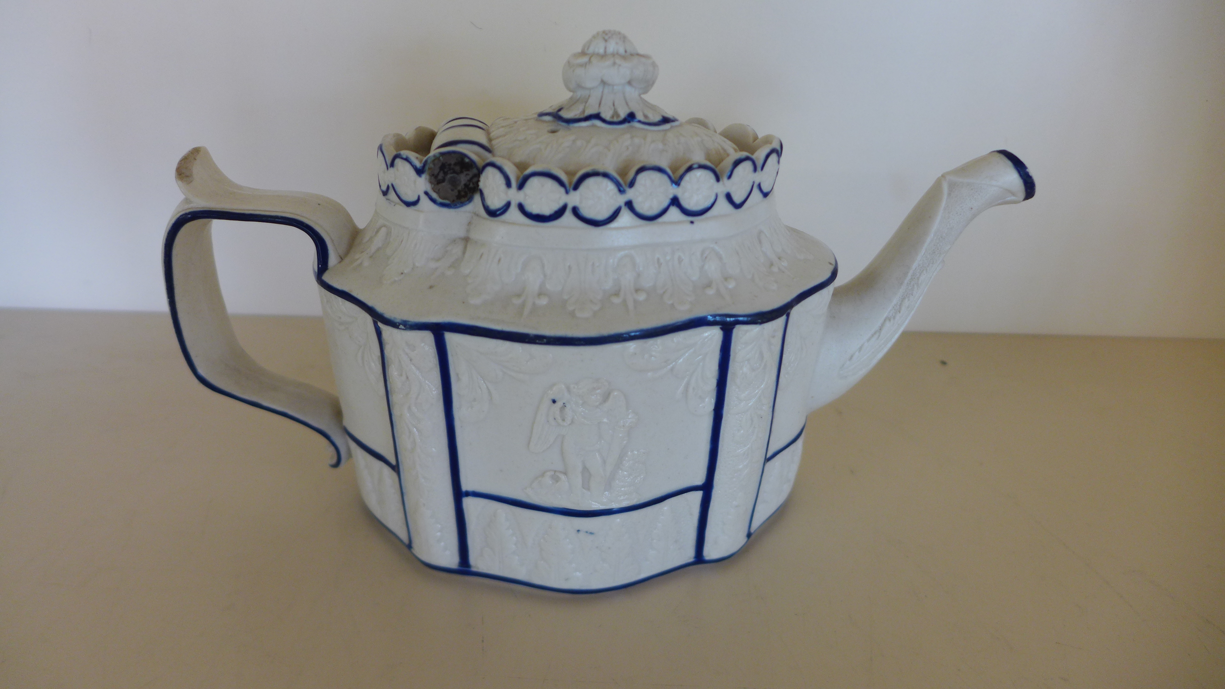 A 19th century Castleford type teapot with hinged cover and classical decoration - crack to body, - Image 2 of 2