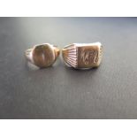 Two 9ct gold signet rings - One with plain panel, size N - One with the engraved initials NGA,