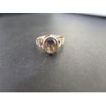 A 9ct gold smokey quartz single-stone ring - Hallmarked Birmingham - Ring size R - Weight approx 2.