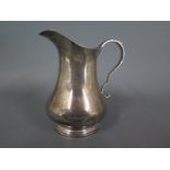 A silver hallmarked milk jug - mark for Birmingham 1960-61 - Weight approx.