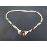 A fancy-link necklet - With two hands to the front - Stamped 585 - Length 41cms - Weight approx 43.