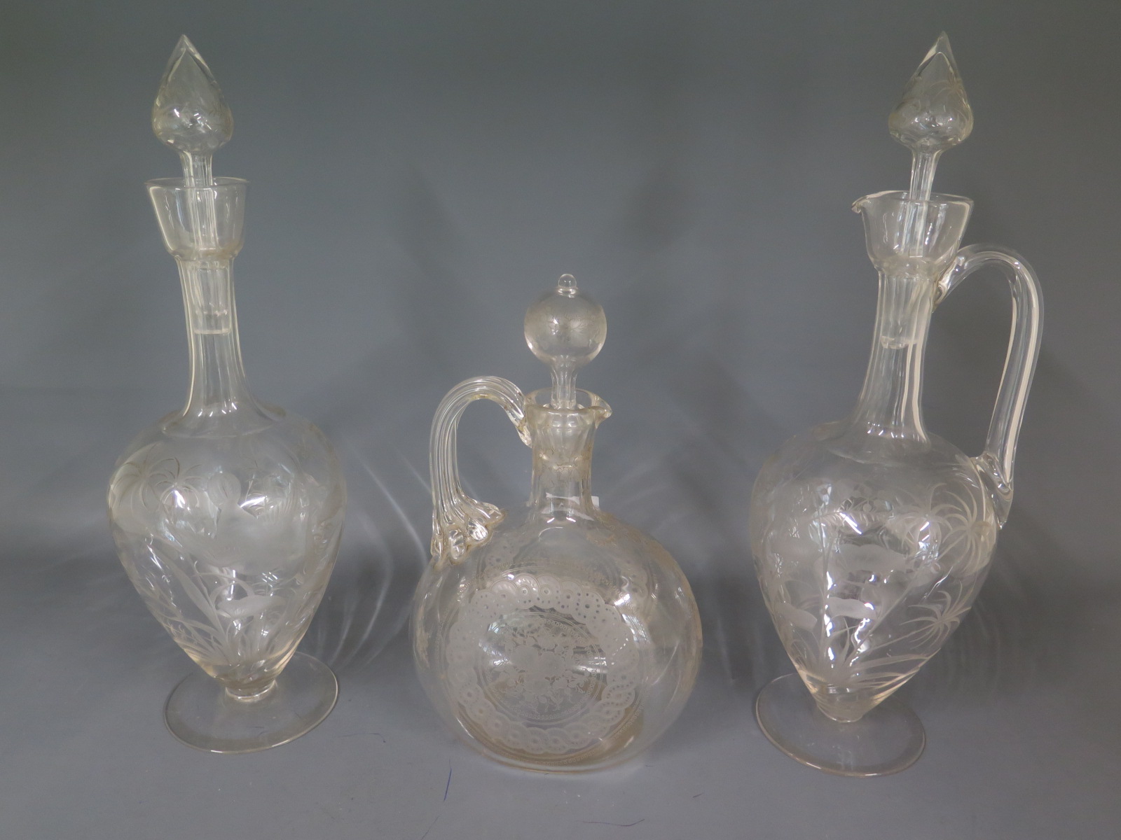 Three etched glass decanters - all good condition