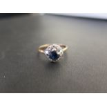 A sapphire and diamond cluster ring - Tests as higher carat gold - Ring size K 1/2 - Weight approx