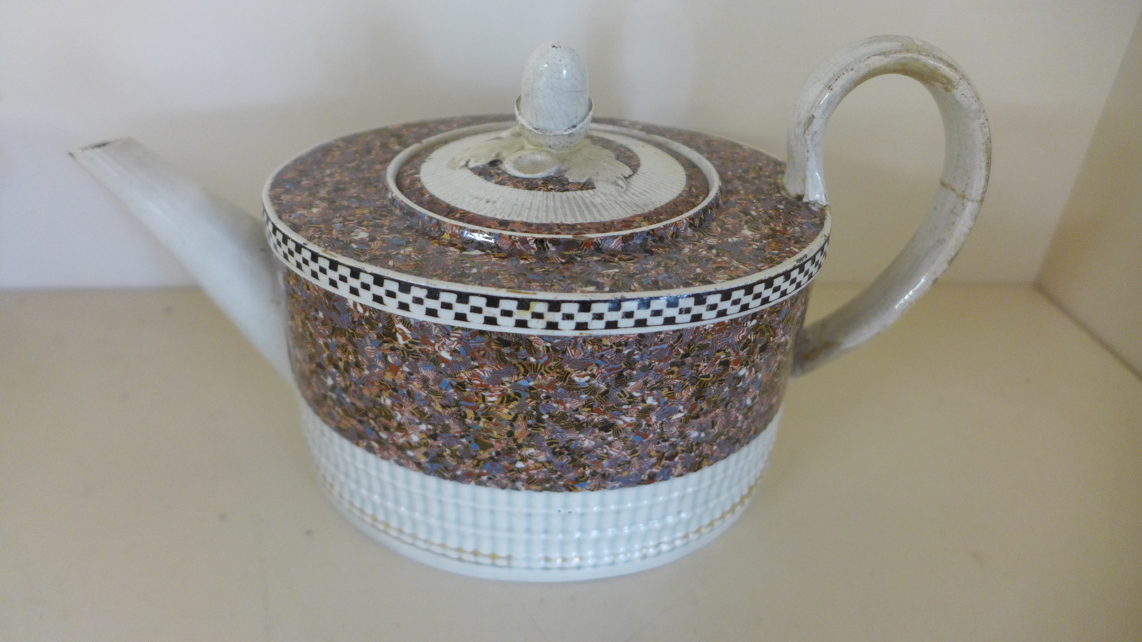 An 18th century teapot with marbalized decoration possibly Leeds - restoration to lid and handle -