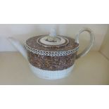 An 18th century teapot with marbalized decoration possibly Leeds - restoration to lid and handle -