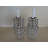 A pair of cut glass two tier lustre candlesticks - Height 24cm x 10cm diameter - generally good